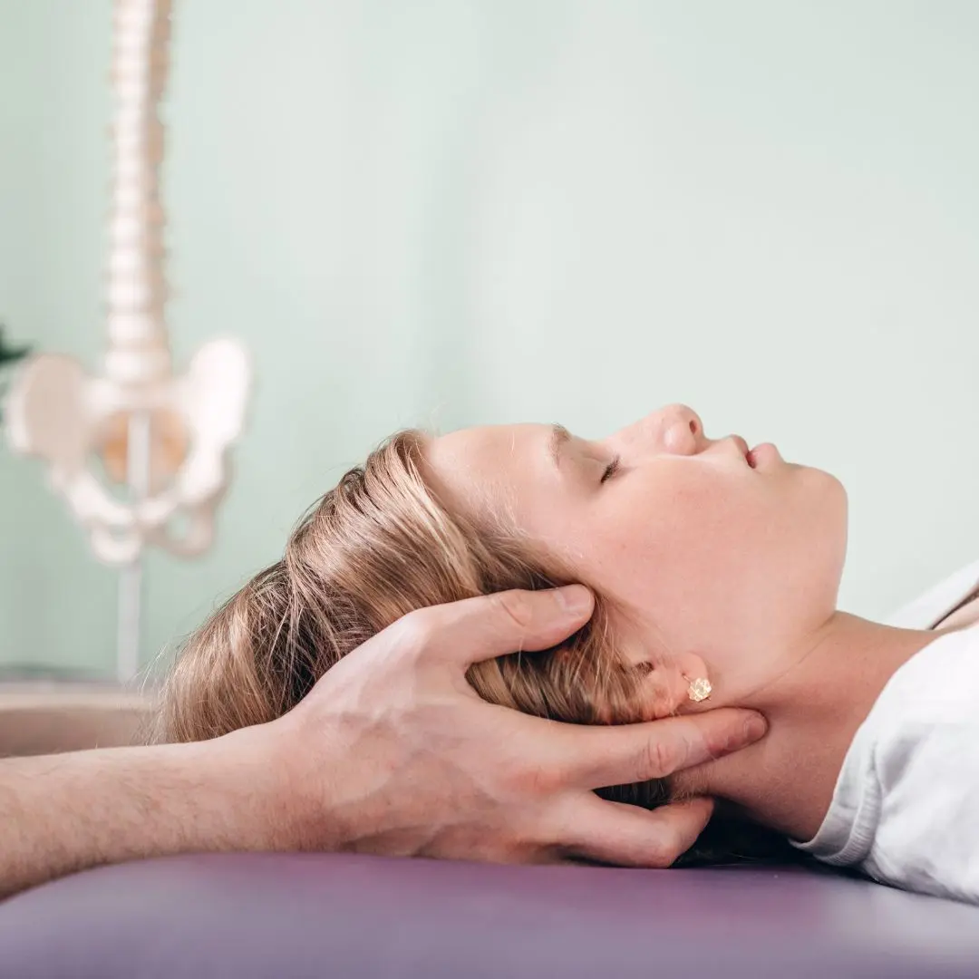 Muscle tension and headaches therapist applying aromatherapy techniques to relieve neck tension and headaches