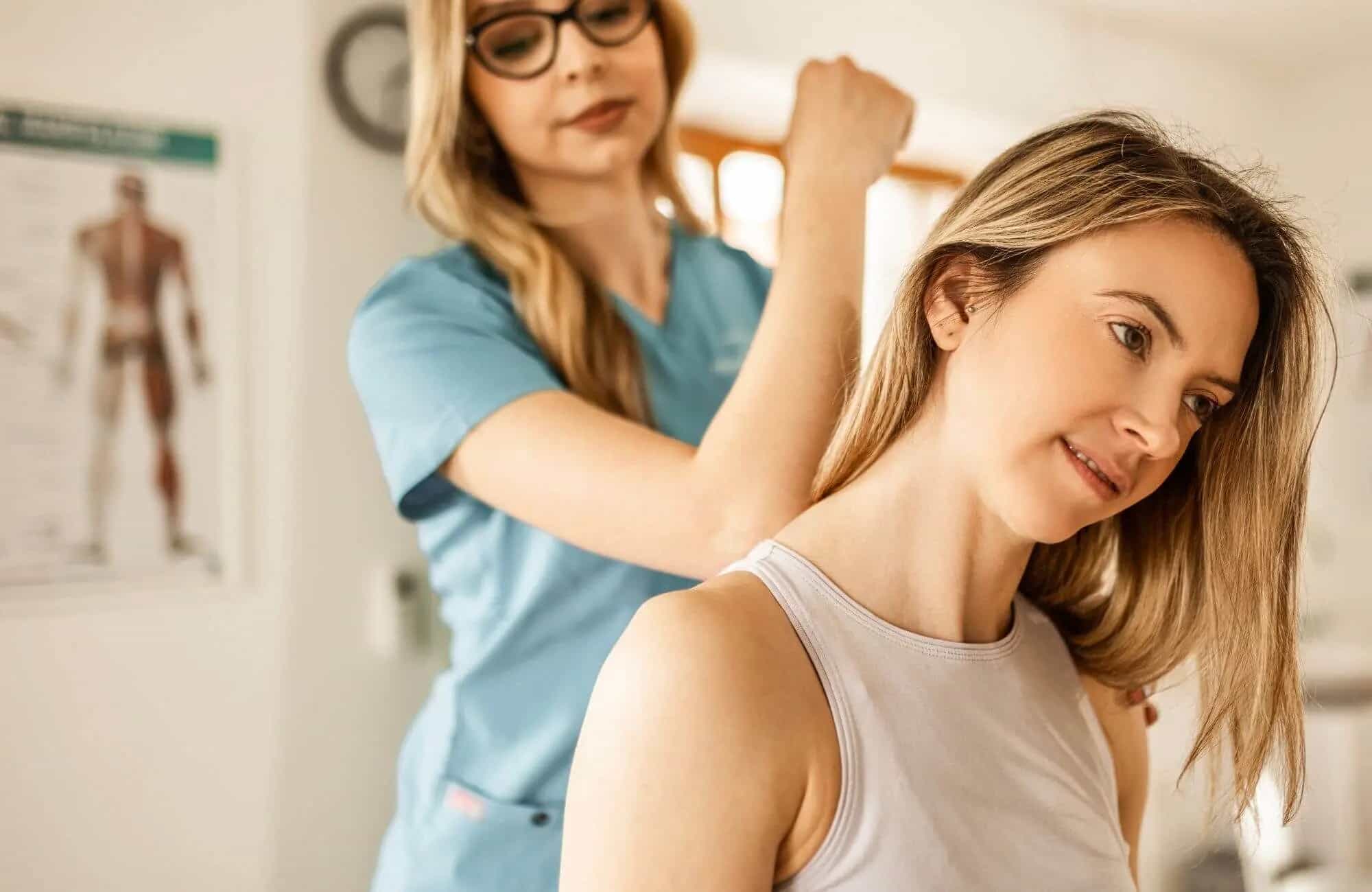 Chronic Back, Neck, or Joint Pain Female patient receiving chiropractic rehab for chronic neck and back pain Washington PA