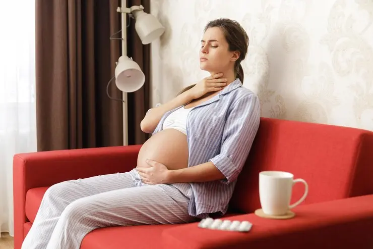 young-woman-sitting-sofa-home_1048944-12400939