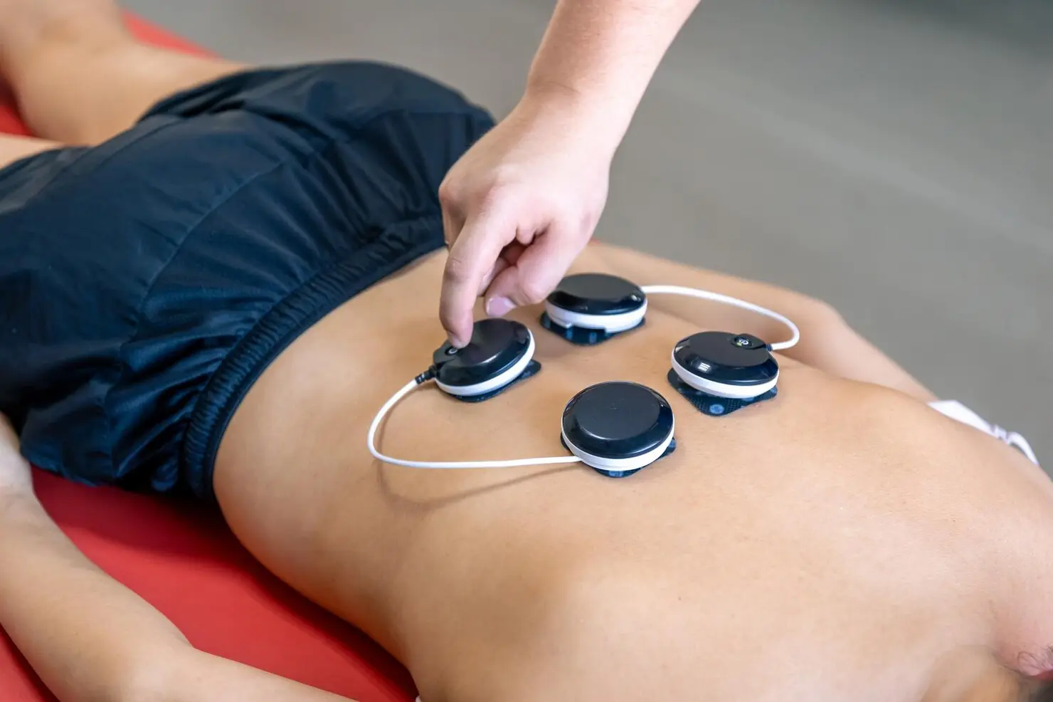 woman-receiving-myostimulation-treatment-physical-therapy-clinic_169016-43505
